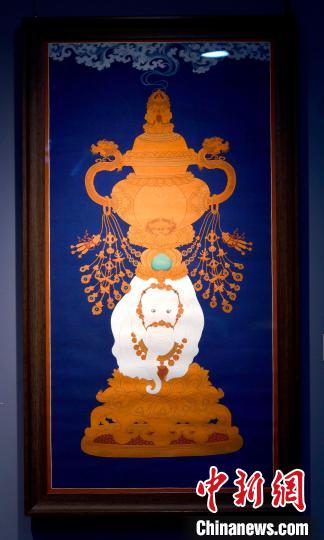 圖為5月16日，展覽中的新創(chuàng)唐卡作品《瑞象承香》?！±盍?攝